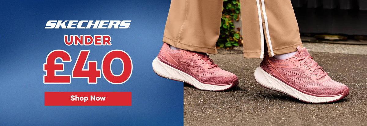 Skechers athletic shoes in pink and white, shown on a model wearing tan track pants. The left side features a blue promotional banner with the text 'SKECHERS UNDER £40 Shop Now'.